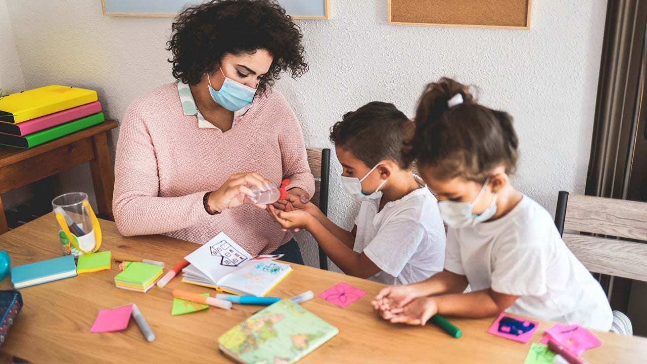 Child care worker with two young kids